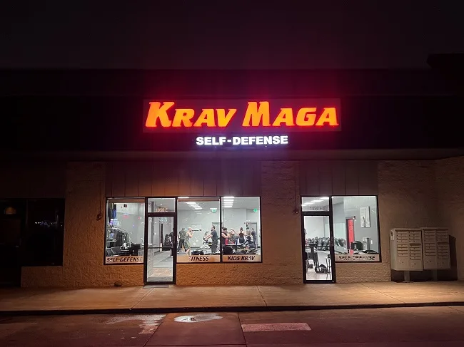 Exterior sign of Colorado Krav Maga Lakewood at night